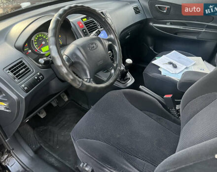 Черный Хендай Туксон, объемом двигателя 2 л и пробегом 276 тыс. км за 7450 $, фото 30 на Automoto.ua