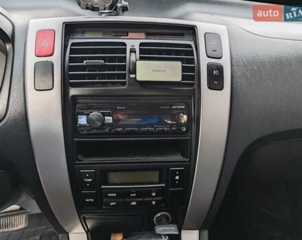 Черный Хендай Туксон, объемом двигателя 2 л и пробегом 182 тыс. км за 9000 $, фото 11 на Automoto.ua