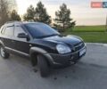 Черный Хендай Туксон, объемом двигателя 1.98 л и пробегом 234 тыс. км за 7500 $, фото 1 на Automoto.ua