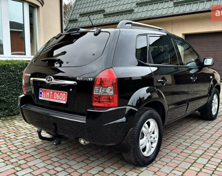Чорний Хендай Туксон, об'ємом двигуна 2 л та пробігом 182 тис. км за 8299 $, фото 4 на Automoto.ua
