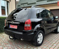 Чорний Хендай Туксон, об'ємом двигуна 2 л та пробігом 182 тис. км за 8299 $, фото 4 на Automoto.ua