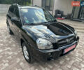 Черный Хендай Туксон, объемом двигателя 2 л и пробегом 218 тыс. км за 8700 $, фото 1 на Automoto.ua