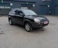 Черный Хендай Туксон, объемом двигателя 2 л и пробегом 255 тыс. км за 8700 $, фото 1 на Automoto.ua