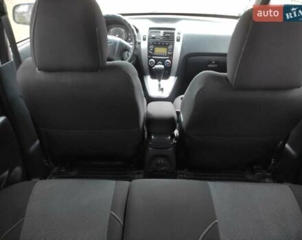 Черный Хендай Туксон, объемом двигателя 2 л и пробегом 237 тыс. км за 7500 $, фото 10 на Automoto.ua