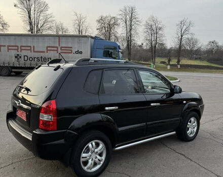 Черный Хендай Туксон, объемом двигателя 2 л и пробегом 210 тыс. км за 7850 $, фото 13 на Automoto.ua