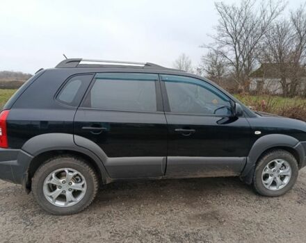 Черный Хендай Туксон, объемом двигателя 2 л и пробегом 276 тыс. км за 8500 $, фото 2 на Automoto.ua