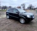 Черный Хендай Туксон, объемом двигателя 2 л и пробегом 235 тыс. км за 9300 $, фото 1 на Automoto.ua