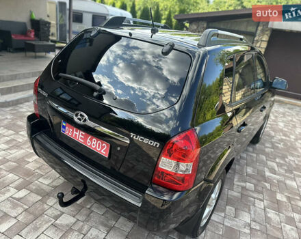 Черный Хендай Туксон, объемом двигателя 2 л и пробегом 218 тыс. км за 8700 $, фото 13 на Automoto.ua