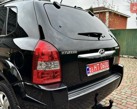 Чорний Хендай Туксон, об'ємом двигуна 2 л та пробігом 182 тис. км за 8299 $, фото 13 на Automoto.ua