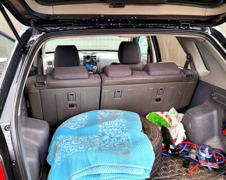 Черный Хендай Туксон, объемом двигателя 2 л и пробегом 223 тыс. км за 7500 $, фото 5 на Automoto.ua