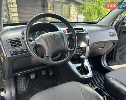 Черный Хендай Туксон, объемом двигателя 2 л и пробегом 218 тыс. км за 8700 $, фото 23 на Automoto.ua