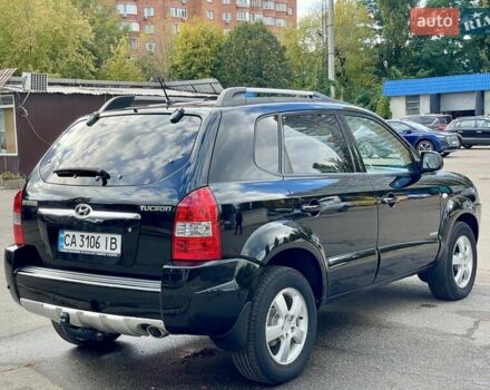 Черный Хендай Туксон, объемом двигателя 1.98 л и пробегом 172 тыс. км за 8500 $, фото 7 на Automoto.ua