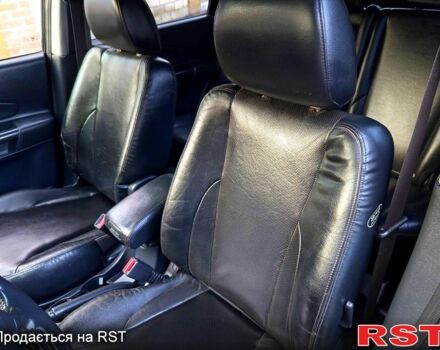 Черный Хендай Туксон, объемом двигателя 2 л и пробегом 187 тыс. км за 7900 $, фото 7 на Automoto.ua