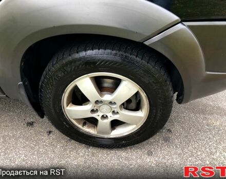 Черный Хендай Туксон, объемом двигателя 2 л и пробегом 220 тыс. км за 8000 $, фото 7 на Automoto.ua