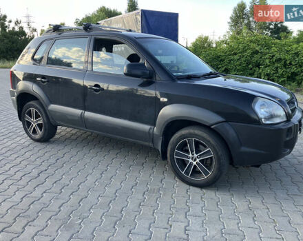 Черный Хендай Туксон, объемом двигателя 1.98 л и пробегом 250 тыс. км за 7200 $, фото 4 на Automoto.ua