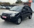 Черный Хендай Туксон, объемом двигателя 1.98 л и пробегом 235 тыс. км за 7500 $, фото 1 на Automoto.ua