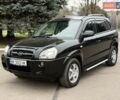Черный Хендай Туксон, объемом двигателя 1.99 л и пробегом 240 тыс. км за 7200 $, фото 1 на Automoto.ua