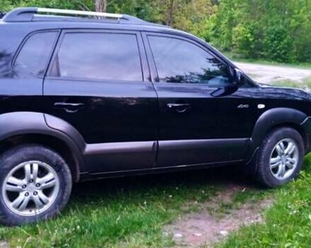 Черный Хендай Туксон, объемом двигателя 1.98 л и пробегом 200 тыс. км за 6600 $, фото 1 на Automoto.ua