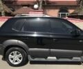 Черный Хендай Туксон, объемом двигателя 2 л и пробегом 150 тыс. км за 8100 $, фото 3 на Automoto.ua