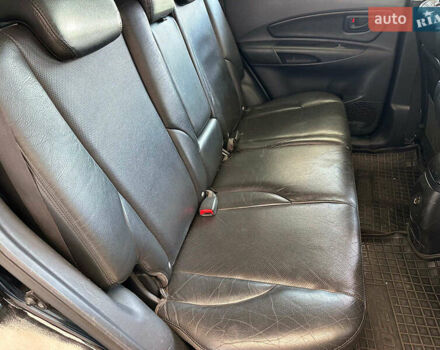 Черный Хендай Туксон, объемом двигателя 2.7 л и пробегом 158 тыс. км за 7940 $, фото 14 на Automoto.ua