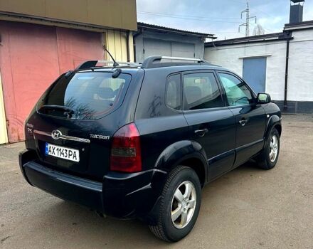 Черный Хендай Туксон, объемом двигателя 2 л и пробегом 215 тыс. км за 6700 $, фото 2 на Automoto.ua