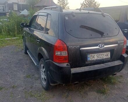 Черный Хендай Туксон, объемом двигателя 1.99 л и пробегом 239 тыс. км за 7700 $, фото 5 на Automoto.ua