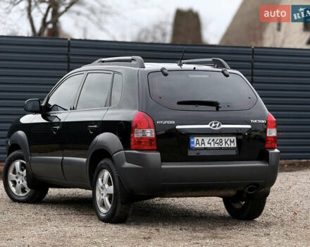 Черный Хендай Туксон, объемом двигателя 2 л и пробегом 252 тыс. км за 7200 $, фото 5 на Automoto.ua