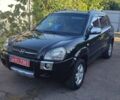 Черный Хендай Туксон, объемом двигателя 2 л и пробегом 214 тыс. км за 8350 $, фото 1 на Automoto.ua