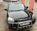 Черный Хендай Туксон, объемом двигателя 2 л и пробегом 270 тыс. км за 7600 $, фото 1 на Automoto.ua