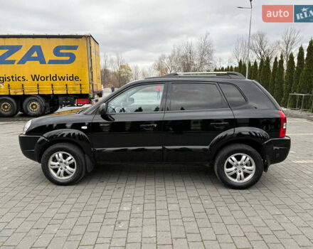 Черный Хендай Туксон, объемом двигателя 1.98 л и пробегом 205 тыс. км за 7950 $, фото 7 на Automoto.ua