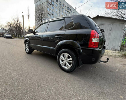 Черный Хендай Туксон, объемом двигателя 1.98 л и пробегом 196 тыс. км за 7999 $, фото 4 на Automoto.ua
