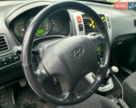 Чорний Хендай Туксон, об'ємом двигуна 2 л та пробігом 225 тис. км за 8000 $, фото 44 на Automoto.ua