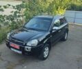 Черный Хендай Туксон, объемом двигателя 2 л и пробегом 214 тыс. км за 8350 $, фото 1 на Automoto.ua