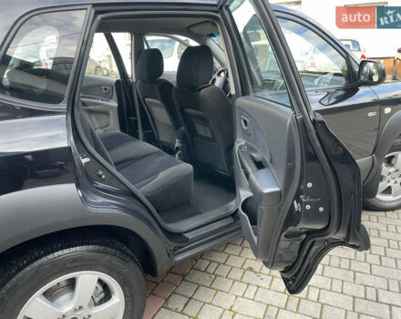 Черный Хендай Туксон, объемом двигателя 1.98 л и пробегом 177 тыс. км за 7600 $, фото 23 на Automoto.ua