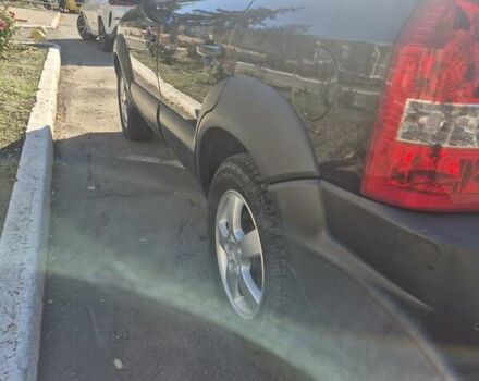 Черный Хендай Туксон, объемом двигателя 1.98 л и пробегом 93 тыс. км за 11800 $, фото 4 на Automoto.ua