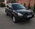 Черный Хендай Туксон, объемом двигателя 2 л и пробегом 221 тыс. км за 8600 $, фото 1 на Automoto.ua