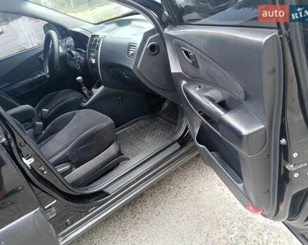 Черный Хендай Туксон, объемом двигателя 1.98 л и пробегом 157 тыс. км за 7500 $, фото 12 на Automoto.ua