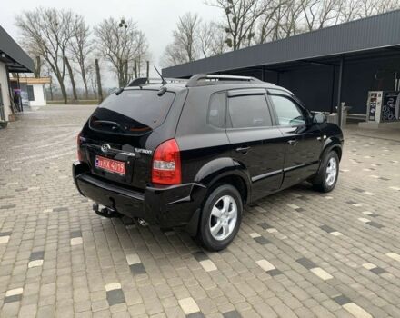 Черный Хендай Туксон, объемом двигателя 2 л и пробегом 198 тыс. км за 7500 $, фото 1 на Automoto.ua