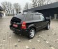 Черный Хендай Туксон, объемом двигателя 2 л и пробегом 198 тыс. км за 7500 $, фото 1 на Automoto.ua