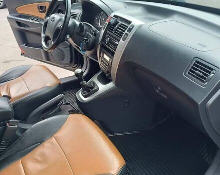 Черный Хендай Туксон, объемом двигателя 2 л и пробегом 255 тыс. км за 8700 $, фото 30 на Automoto.ua