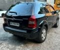 Черный Хендай Туксон, объемом двигателя 2 л и пробегом 245 тыс. км за 6500 $, фото 4 на Automoto.ua