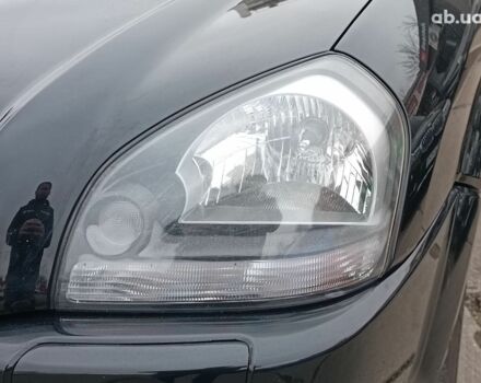 Чорний Хендай Туксон, об'ємом двигуна 2 л та пробігом 192 тис. км за 7990 $, фото 4 на Automoto.ua