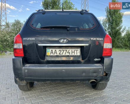 Черный Хендай Туксон, объемом двигателя 1.98 л и пробегом 250 тыс. км за 7200 $, фото 7 на Automoto.ua