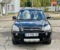 Черный Хендай Туксон, объемом двигателя 1.98 л и пробегом 172 тыс. км за 8500 $, фото 2 на Automoto.ua