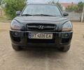 Черный Хендай Туксон, объемом двигателя 1.98 л и пробегом 350 тыс. км за 9000 $, фото 1 на Automoto.ua