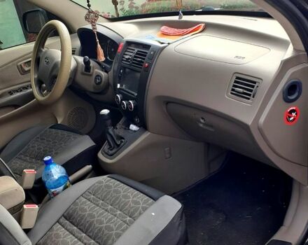 Черный Хендай Туксон, объемом двигателя 2 л и пробегом 240 тыс. км за 7500 $, фото 11 на Automoto.ua