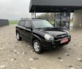 Черный Хендай Туксон, объемом двигателя 2 л и пробегом 198 тыс. км за 7500 $, фото 1 на Automoto.ua