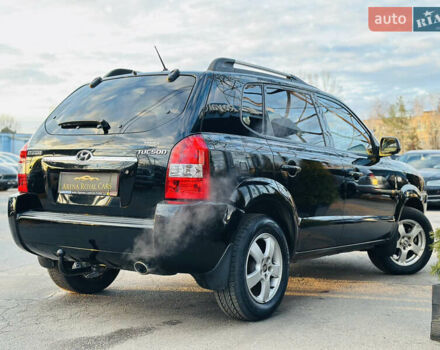 Чорний Хендай Туксон, об'ємом двигуна 2 л та пробігом 186 тис. км за 8300 $, фото 1 на Automoto.ua
