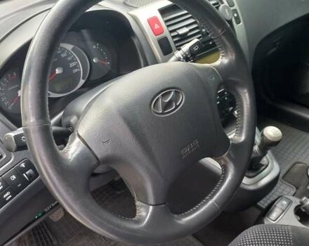 Черный Хендай Туксон, объемом двигателя 2 л и пробегом 168 тыс. км за 9000 $, фото 24 на Automoto.ua