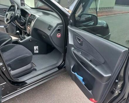 Черный Хендай Туксон, объемом двигателя 2 л и пробегом 168 тыс. км за 9000 $, фото 47 на Automoto.ua